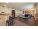 Inviting living room with a bar, stone fireplace, and comfortable seating at 11648 Broken Arrow Dr, Conifer, CO 80433