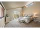Serene main bedroom with plenty of natural light and balcony access at 11648 Broken Arrow Dr, Conifer, CO 80433