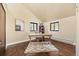 Spacious office featuring hardwood floors, a desk, and two windows at 11648 Broken Arrow Dr, Conifer, CO 80433