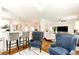 View of kitchen and living room from the bar area at 1585 Spruce St, Denver, CO 80220