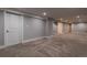 Large finished basement with neutral carpet, white walls, and recessed lighting, perfect for versatile use at 1601 S Glencoe St, Denver, CO 80222