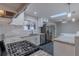 Beautiful kitchen featuring stainless appliances, granite counters, and a bright open floorplan at 1601 S Glencoe St, Denver, CO 80222