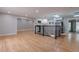 Bright open concept living room with hardwood floors, recessed lighting, and open access to the kitchen at 1601 S Glencoe St, Denver, CO 80222