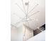 Unique and modern chandelier fixture with multiple bulbs and a geometric design at 1555 W 43Rd Ave, Denver, CO 80211