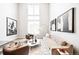 Bright and airy living room features soaring ceilings, large windows, and stylish decor at 1555 W 43Rd Ave, Denver, CO 80211