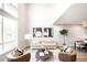 Inviting living room with a large window, comfortable seating, and a modern rug at 1555 W 43Rd Ave, Denver, CO 80211