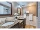 Bathroom with granite countertops, wood tile flooring, and dual sinks at 431 S Balsam St, Lakewood, CO 80226