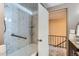 Well-lit bathroom featuring a shower/tub with marble surround at 431 S Balsam St, Lakewood, CO 80226