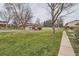 View of the community with green spaces and mature trees, creating a peaceful atmosphere at 431 S Balsam St, Lakewood, CO 80226