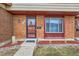 Exterior of a brick building, front door, and window at 431 S Balsam St, Lakewood, CO 80226
