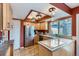 Well-lit kitchen with stainless steel appliances, ample cabinetry, and functional island at 431 S Balsam St, Lakewood, CO 80226