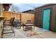 Cozy patio space with modern furniture and a privacy fence at 431 S Balsam St, Lakewood, CO 80226