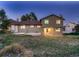 Spacious backyard featuring a patio, lush grass and mature landscaping at 8916 Sunridge Hollow Rd, Parker, CO 80134