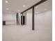 Finished basement featuring neutral carpet, white shiplap walls, a bar area and dark support beams at 8916 Sunridge Hollow Rd, Parker, CO 80134