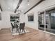 Dining room features hardwood floors, modern lighting, and access to the backyard at 8916 Sunridge Hollow Rd, Parker, CO 80134