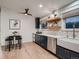 Contemporary kitchen with blue cabinets, stainless steel appliances, and open shelving at 8916 Sunridge Hollow Rd, Parker, CO 80134