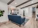 Cozy living room with wooden beams, large bay windows, and modern decor at 8916 Sunridge Hollow Rd, Parker, CO 80134