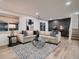 Inviting living room with comfortable seating, contemporary decor, and hardwood flooring at 8916 Sunridge Hollow Rd, Parker, CO 80134