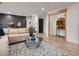 Spacious living room featuring modern decor, hardwood floors, and an inviting seating area at 8916 Sunridge Hollow Rd, Parker, CO 80134