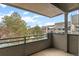 Balcony with mountain and building views, perfect for relaxing and enjoying the scenery at 31719 Rocky Village Dr # 317, Evergreen, CO 80439