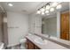 Well-lit bathroom with a large mirror, shower and bath combination at 31719 Rocky Village Dr # 317, Evergreen, CO 80439
