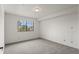 Cozy bedroom with a large window showcasing mountain views at 31719 Rocky Village Dr # 317, Evergreen, CO 80439