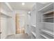 Large closet with wood door and custom shelving for maximum storage at 31719 Rocky Village Dr # 317, Evergreen, CO 80439