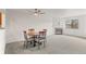 Spacious open-concept dining area with a fireplace, neutral walls, and soft carpeting at 31719 Rocky Village Dr # 317, Evergreen, CO 80439