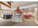 Event room with a stone fireplace, wood beams, and set tables for dining at 31719 Rocky Village Dr # 317, Evergreen, CO 80439
