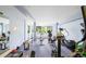 Well-equipped gym with various exercise machines and natural light from windows at 31719 Rocky Village Dr # 317, Evergreen, CO 80439