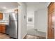 Modern kitchen featuring stainless steel appliances, wood cabinets, and an open layout to the living area at 31719 Rocky Village Dr # 317, Evergreen, CO 80439