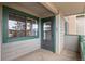 Cozy patio entrance with window and door offering fresh air and natural light at 31719 Rocky Village Dr # 317, Evergreen, CO 80439