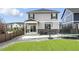 Private backyard featuring a well-maintained lawn, patio area, trampoline, and basketball hoop at 27504 E 1St Pl, Aurora, CO 80018