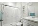 Bathroom with glass shower door, white tile, and vanity with mirror at 27504 E 1St Pl, Aurora, CO 80018
