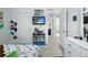 bedroom with a mounted TV, shelving, and a white dresser, creating a playful atmosphere at 27504 E 1St Pl, Aurora, CO 80018