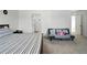 Bright bedroom with a daybed and an ensuite bathroom at 27504 E 1St Pl, Aurora, CO 80018