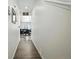 Bright hallway with wood flooring leading into the dining area, creating a seamless transition at 27504 E 1St Pl, Aurora, CO 80018