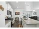Bright kitchen with white cabinets, stainless steel appliances, and a large granite countertop island at 27504 E 1St Pl, Aurora, CO 80018