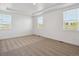 Bright and spacious bedroom with neutral carpet, tray ceiling and large windows for natural light at 1102 Ridgefield Dr, Berthoud, CO 80513