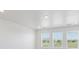 Bedroom featuring three windows and neutral colored carpet throughout at 1102 Ridgefield Dr, Berthoud, CO 80513