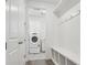 Laundry room featuring a washer and dryer with white cabinetry and shelving at 1102 Ridgefield Dr, Berthoud, CO 80513