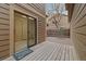 Cozy back patio featuring wood flooring and a sliding glass door for seamless indoor-outdoor living at 1770 S Quintero Way, Aurora, CO 80017