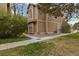 Cozy exterior view of a two story home with well-kept lawn and mature tree near sidewalk at 1770 S Quintero Way, Aurora, CO 80017