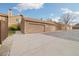 View of multiple attached garages with ample parking space on a concrete driveway at 1770 S Quintero Way, Aurora, CO 80017