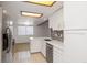 Updated kitchen with ample counter space, white cabinets, and stainless steel appliances at 1770 S Quintero Way, Aurora, CO 80017