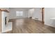 Spacious living room with light-colored floors and a cozy fireplace at 1770 S Quintero Way, Aurora, CO 80017