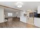 Bright living room featuring updated floors which flow into a modern kitchen at 1770 S Quintero Way, Aurora, CO 80017