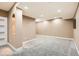 Spacious finished basement has neutral carpet and recessed lighting, offering a flexible space for recreation or relaxation at 736 Trenton St, Denver, CO 80230
