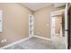 Cozy basement area with neutral carpet and a built-in shelving unit at 736 Trenton St, Denver, CO 80230