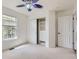 Bright bedroom with a decorative ceiling fan and an organized closet system at 736 Trenton St, Denver, CO 80230